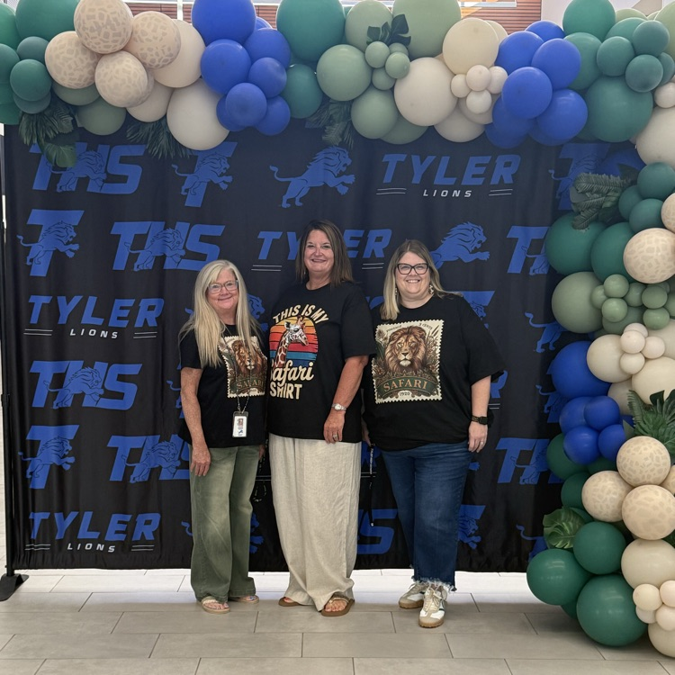 people in front of banner