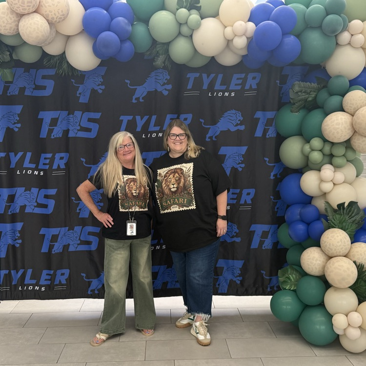 people in front of banner