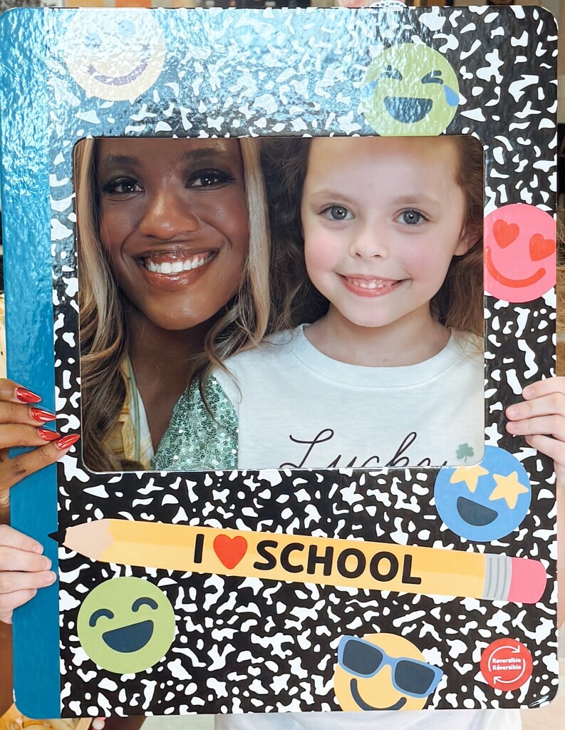Miss Fuller with student in a frame