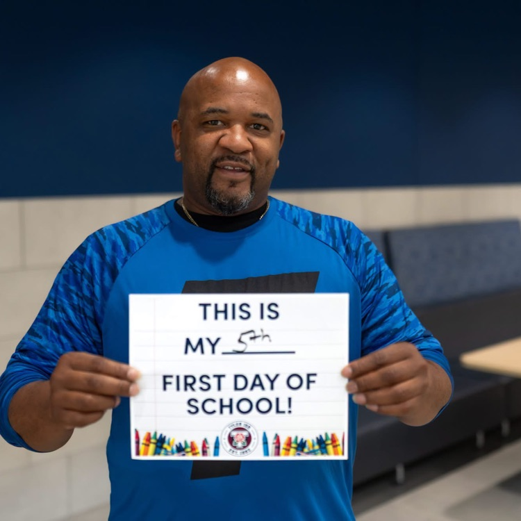 man posing with sign