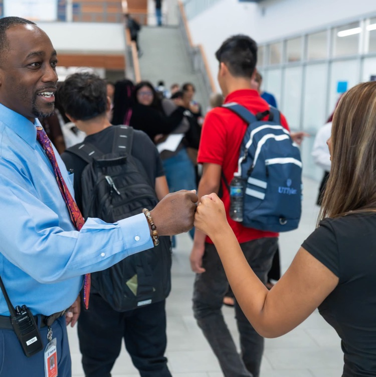 people fist bumping