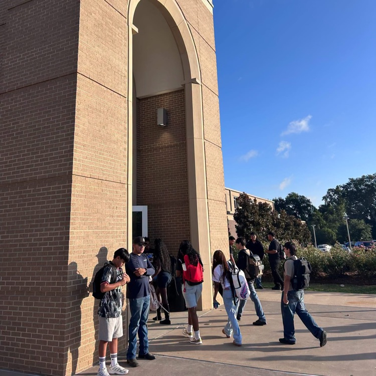 students walking into school
