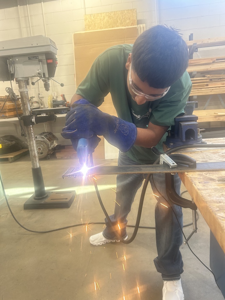student using the plasma cutter