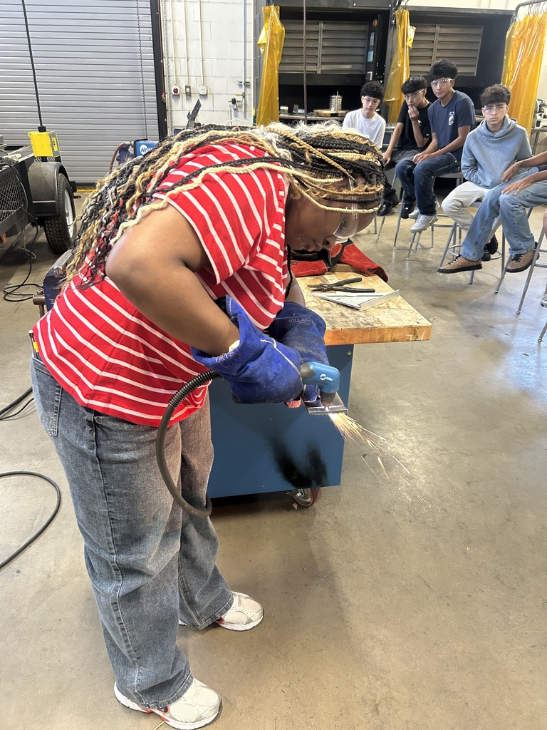 student using plasma cutter