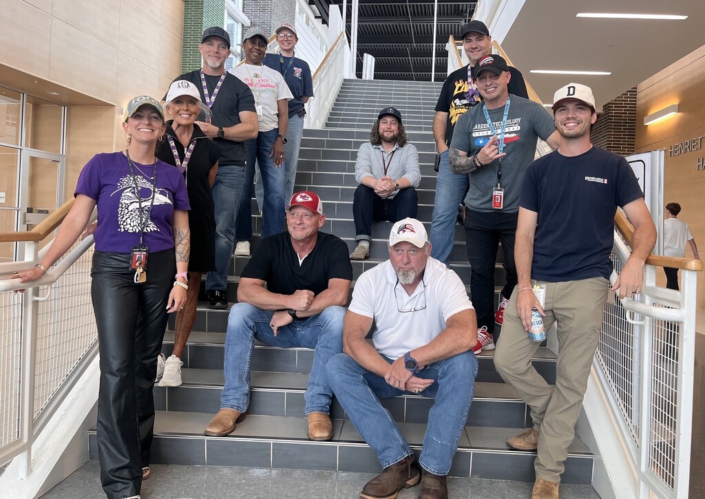 teachers wearing hats on a stairway