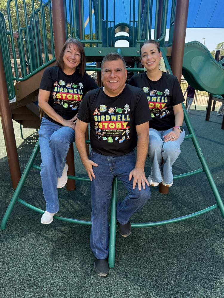 teachers in playground in Birdwell shirt
