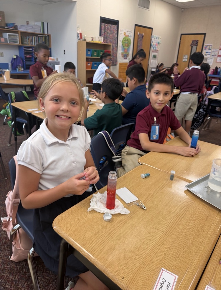 blonde haired girl doing a science experiment