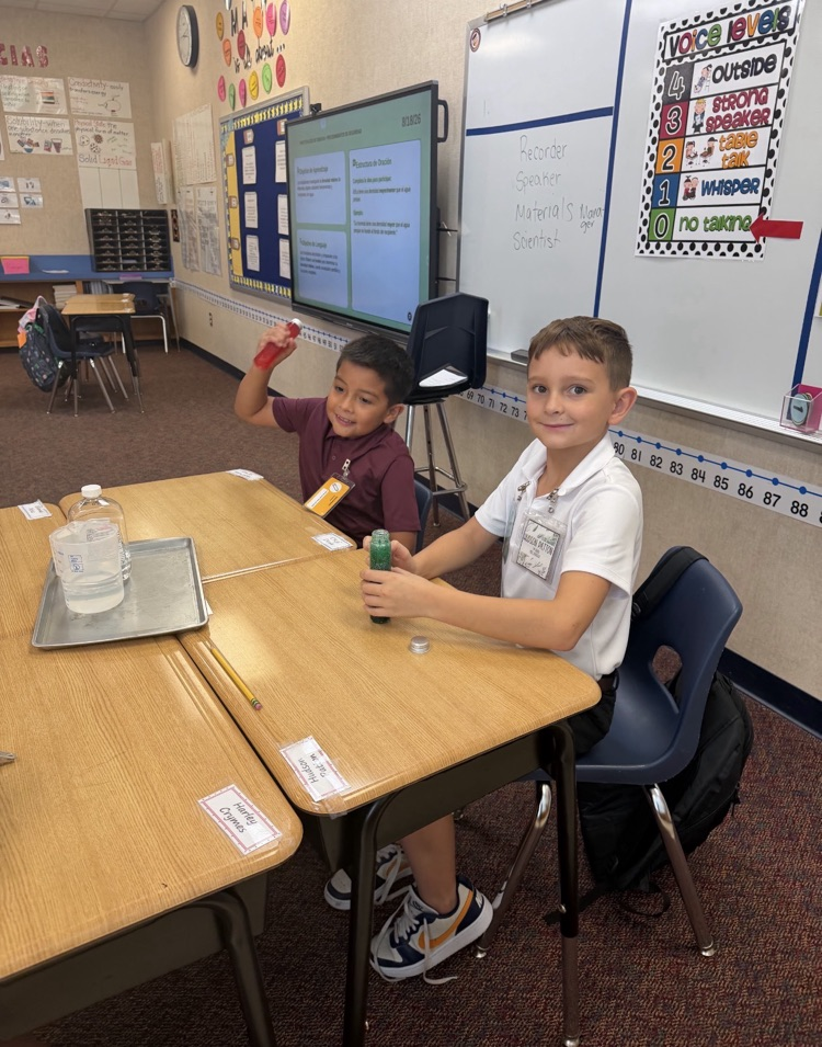 two kids doing a science experiment