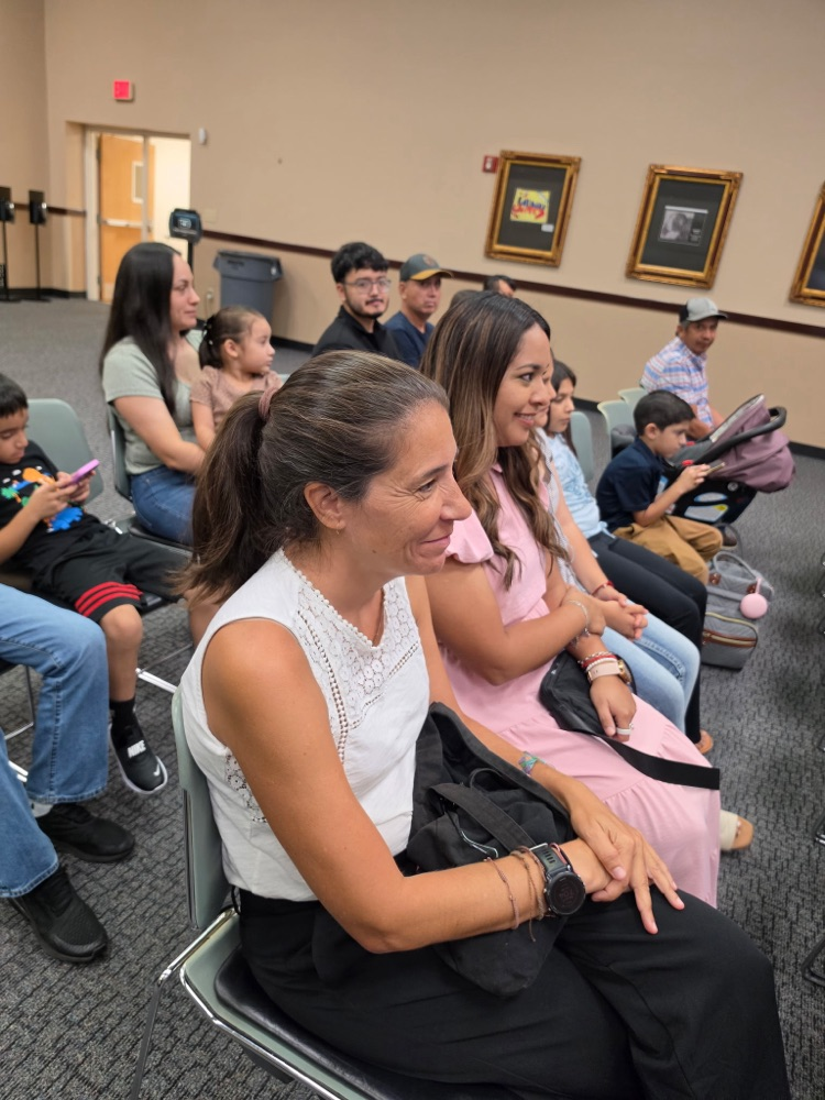 teachers and students at board meeting