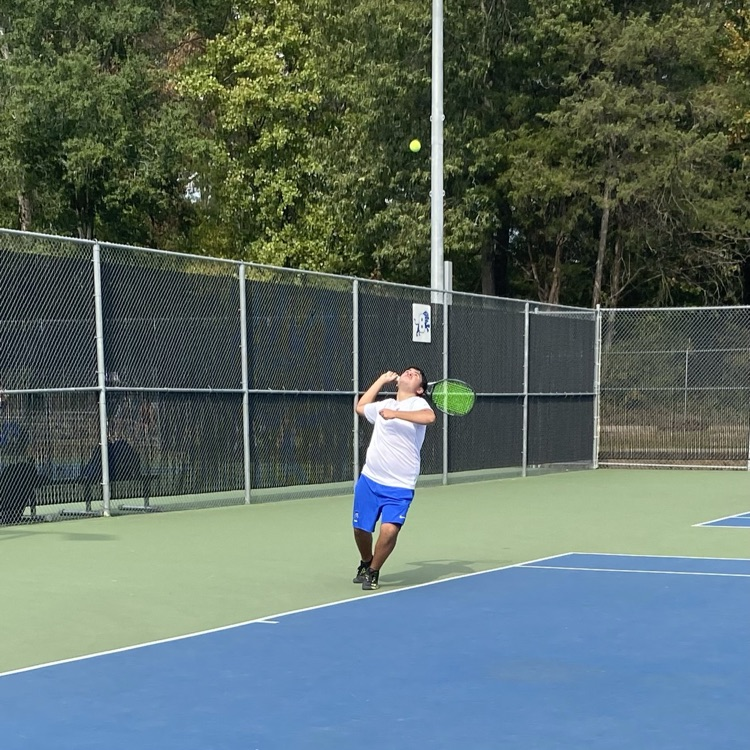tennis player hitting the ball