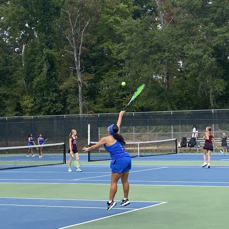 tennis player hitting the ball