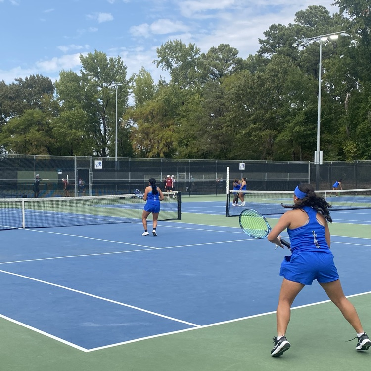 tennis doubles team on court