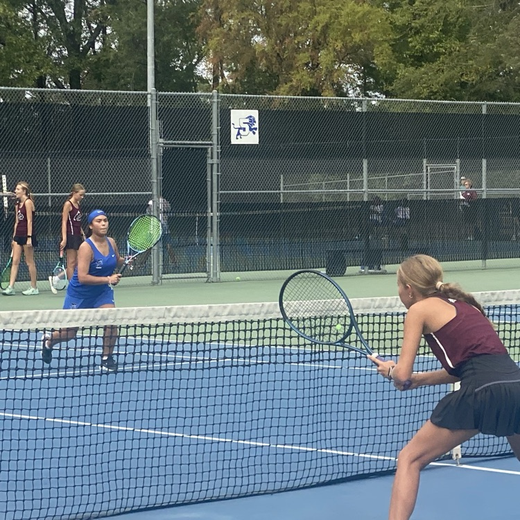 tennis players on court