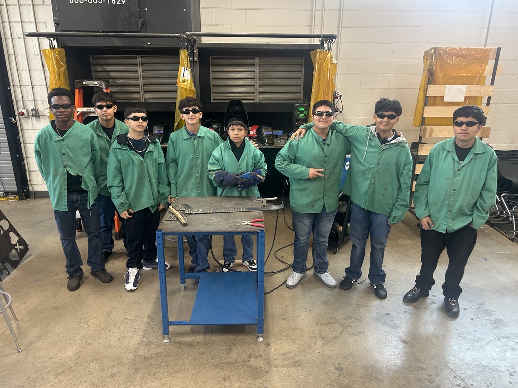 a group of welding students posing for a picture
