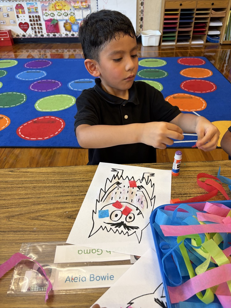 student coloring at table
