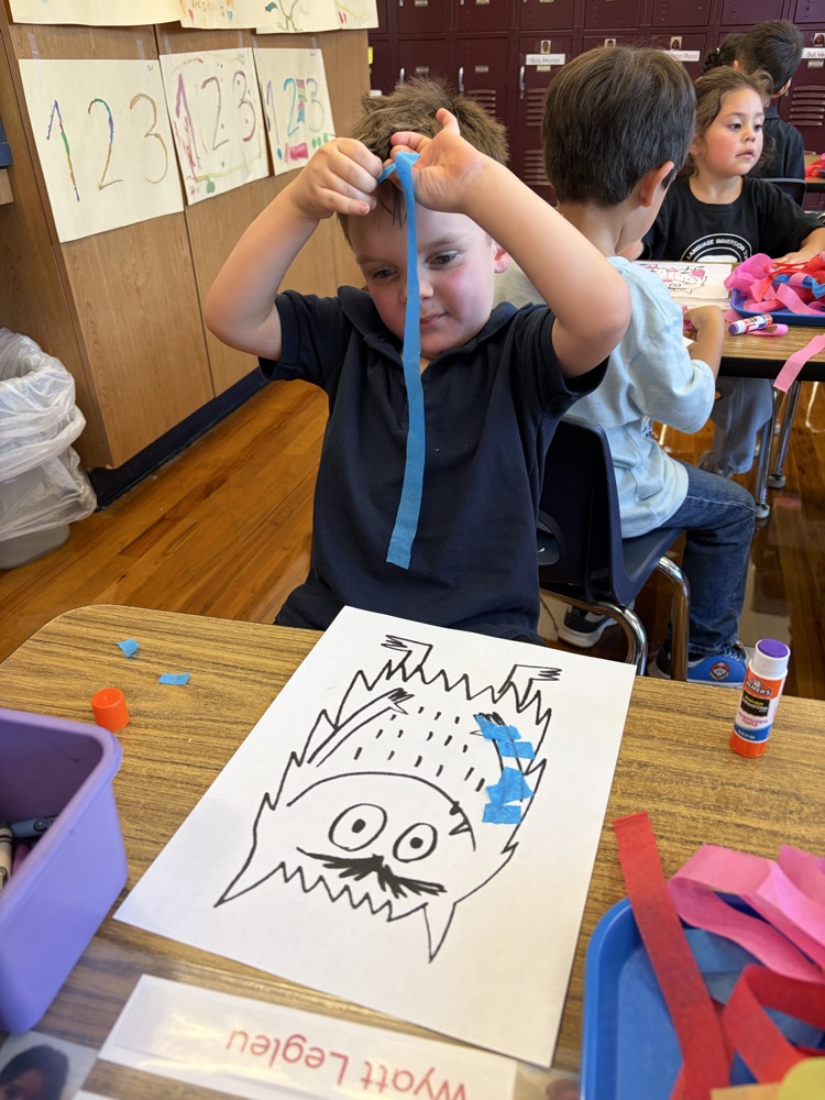 student coloring at table