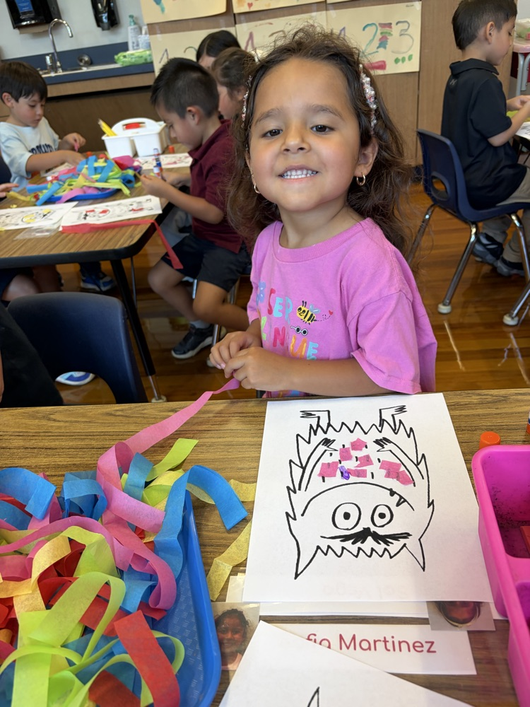 student coloring at table