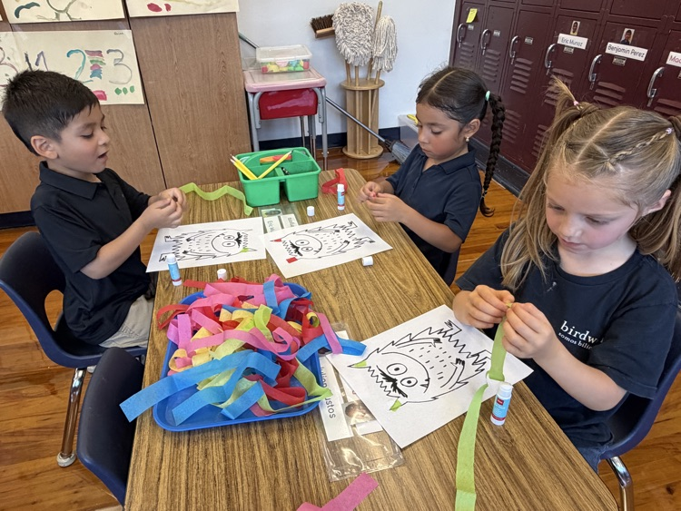 student coloring at table