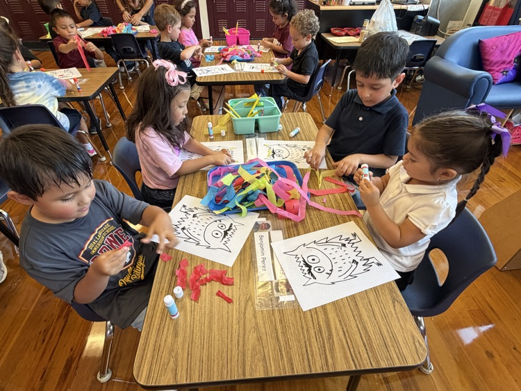 student coloring at table