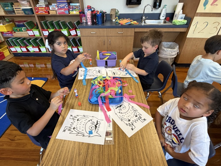 student coloring at table