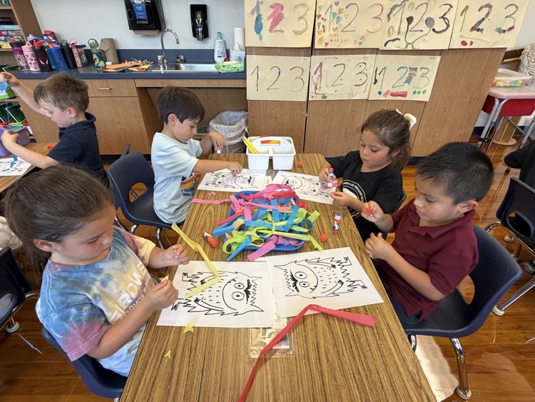 student coloring at table