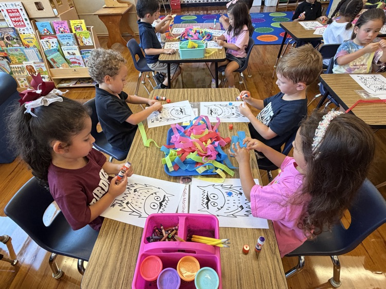 student coloring at table