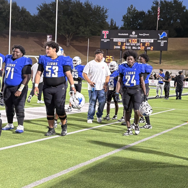 football players in the sidelines
