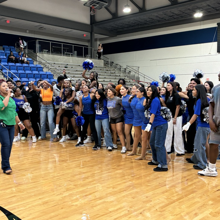 students on the court doing the school song 