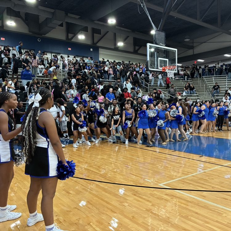 students on the court doing the school song