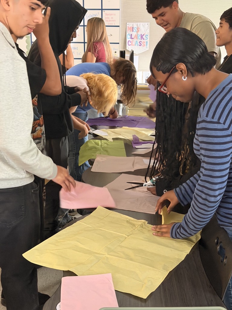 students cutting patterns in Gilded Age workshop