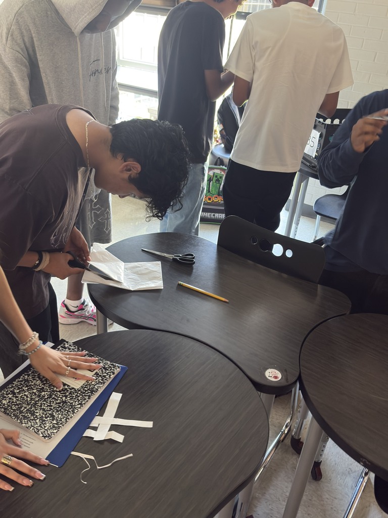 students cutting patterns in a Guilded Age workshop