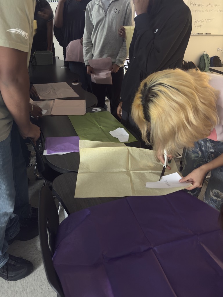 students cutting patterns in a Guilded Age workshop