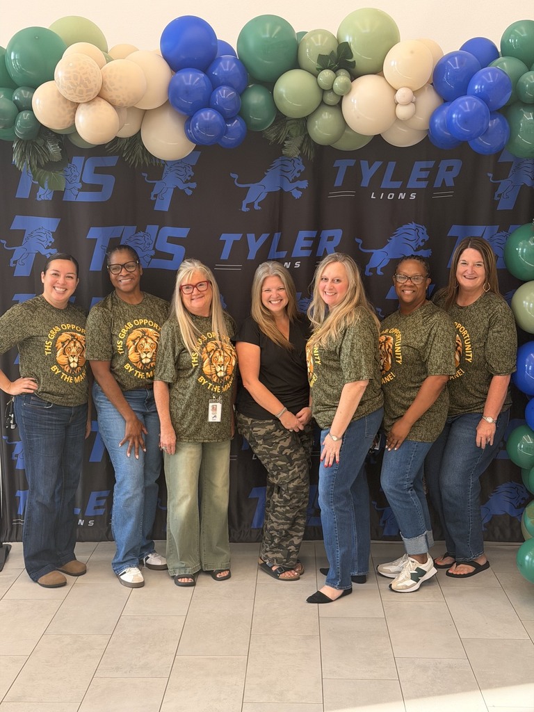 counselors posing with camo