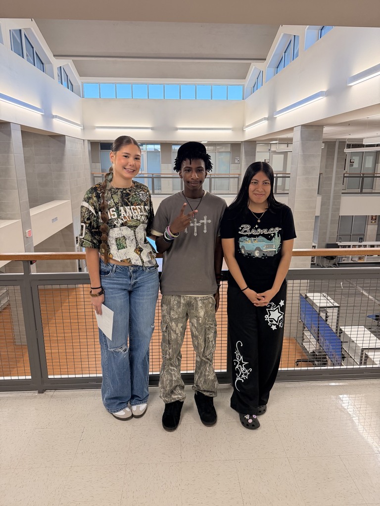 students posing with camo on