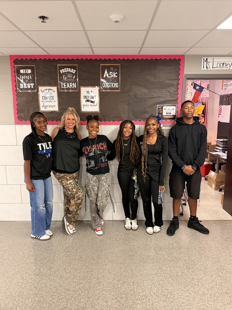 students posing with camo on