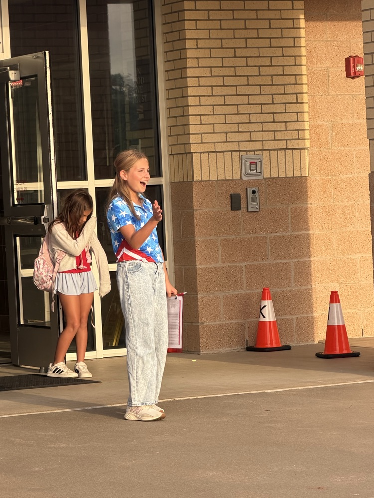 Friday friends welcoming students into school