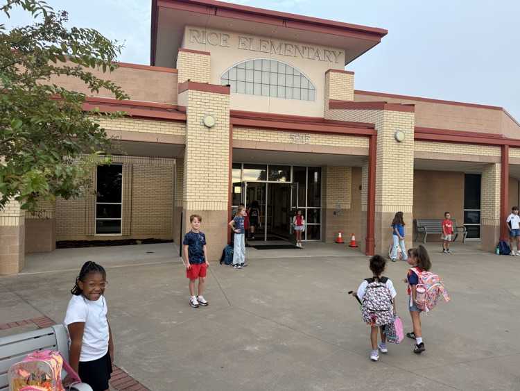 Friday friends welcoming students into school
