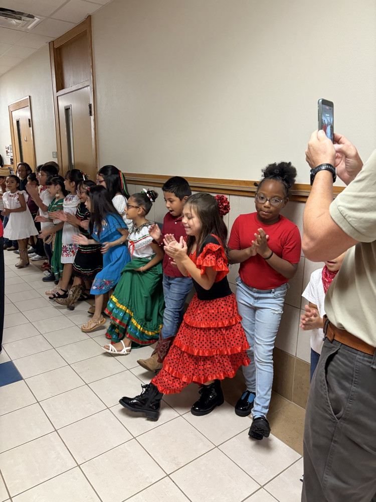 students dress in authentic Hispanic folkwear