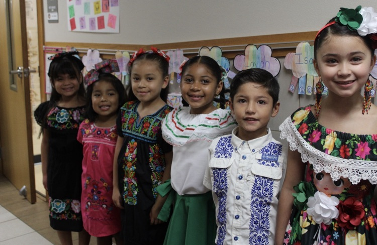 students dress in authentic Hispanic folkwear