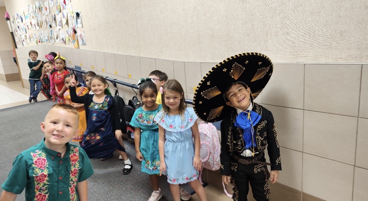 students dress in authentic Hispanic folkwear
