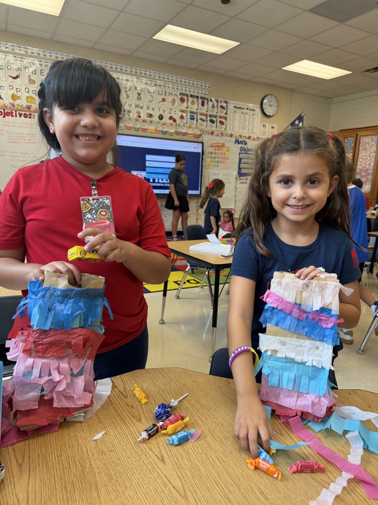kid making a paper bag piñata 