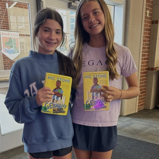 two students with matching books