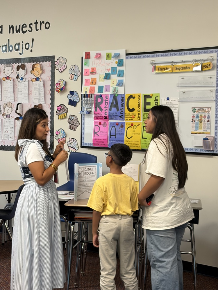 teacher talking to student and parent
