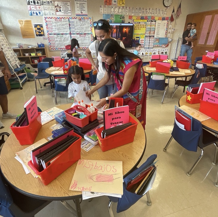 teacher talking to student and parent