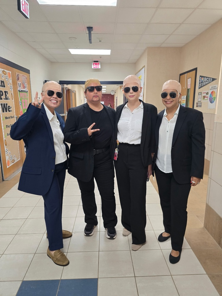 four staff members dressed as Pit Bull