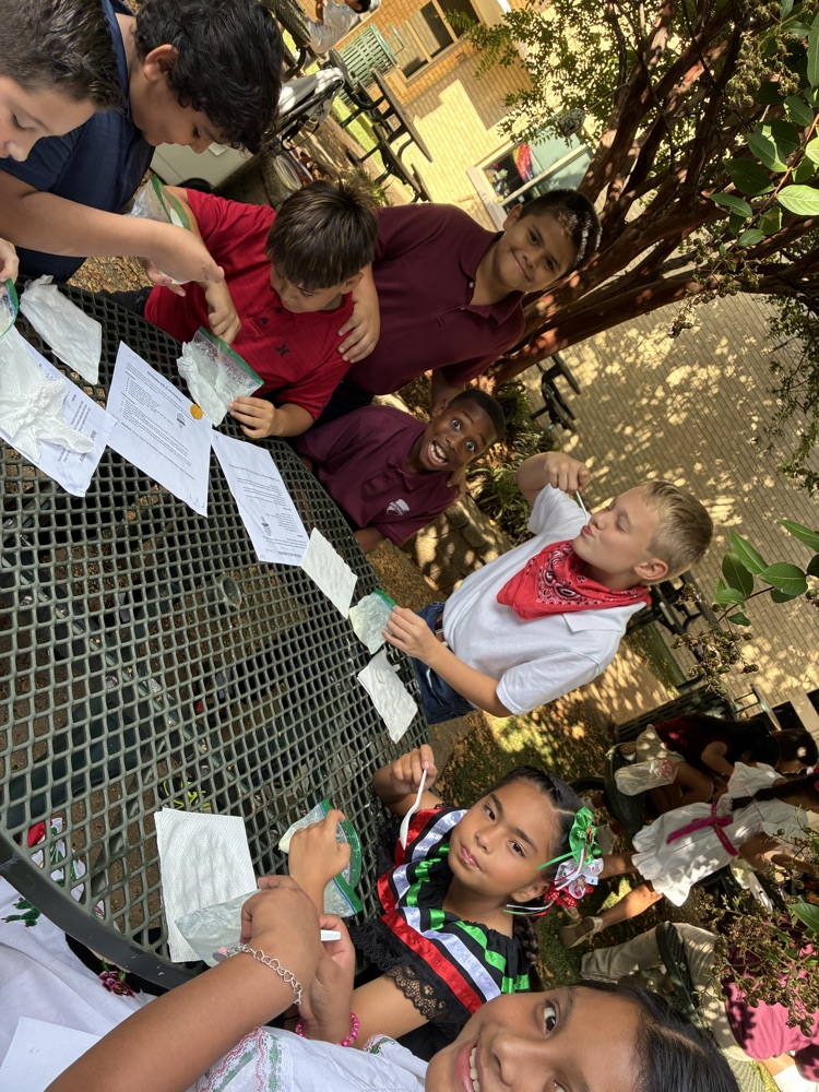 students at table with notebooks and ice cream