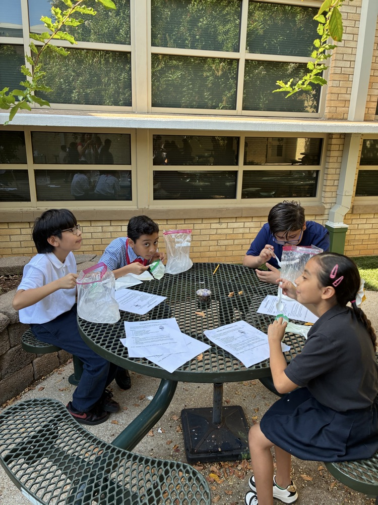 students outside at table