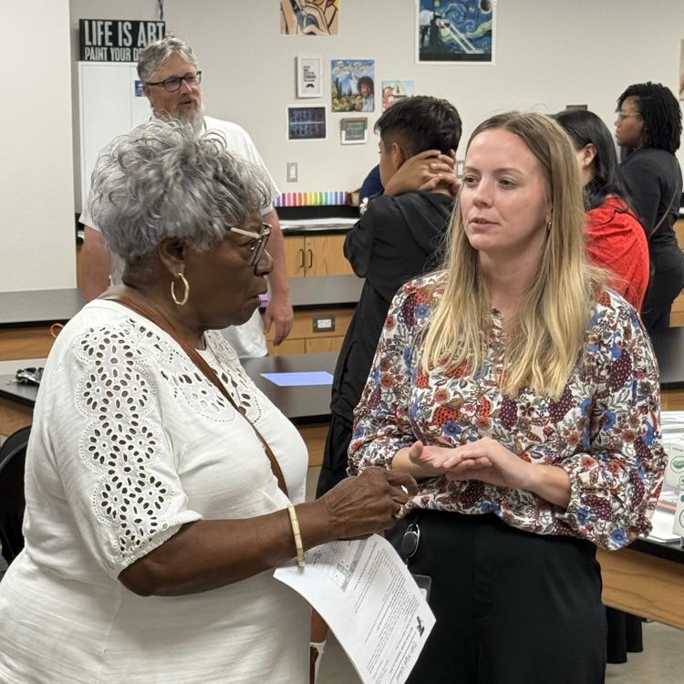 parents and teachers talking at open house