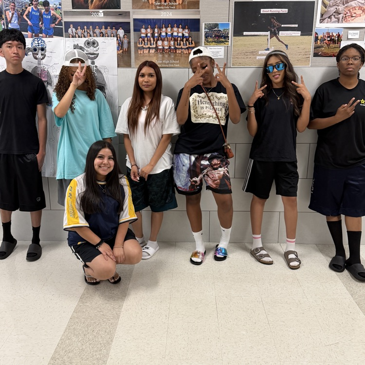 students posing for pictures 