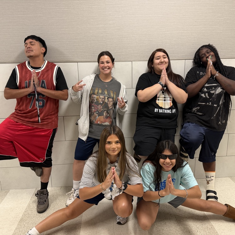 students posing for pictures 